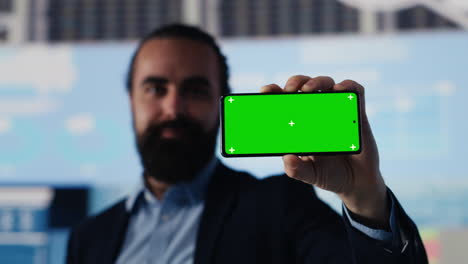 business specialist showing phone display with copy space