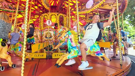 people enjoying a colorful carousel ride