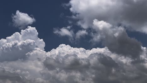 timelapse of blue sky with fast moving white fluffy cloud