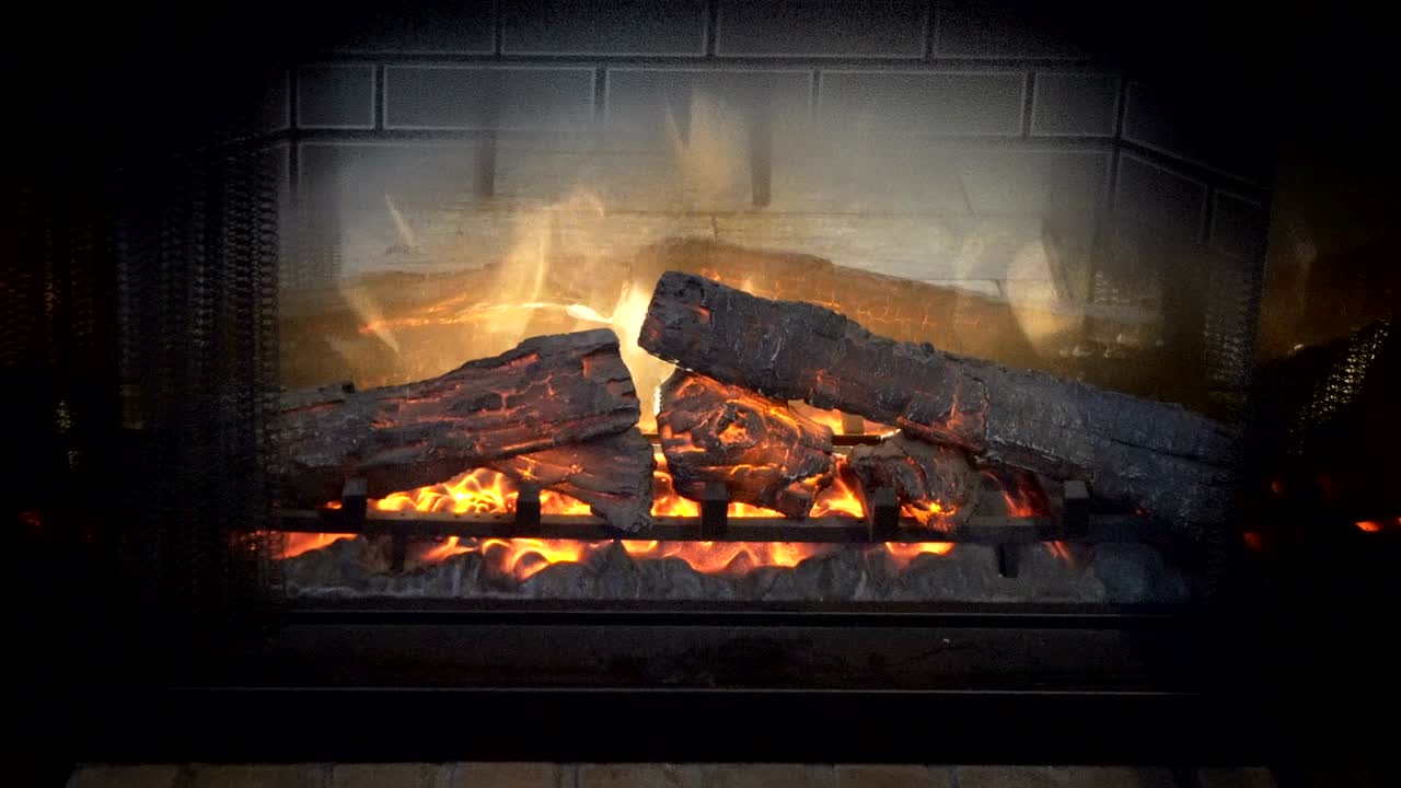 Close up shot of burning firewood in the fireplace, loop background