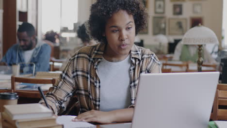 woman studying in a library