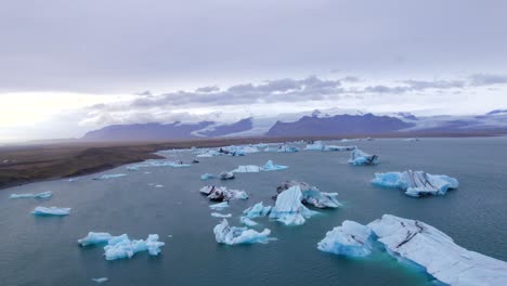 epic drone flight above ice chunks in arctic region at daytime