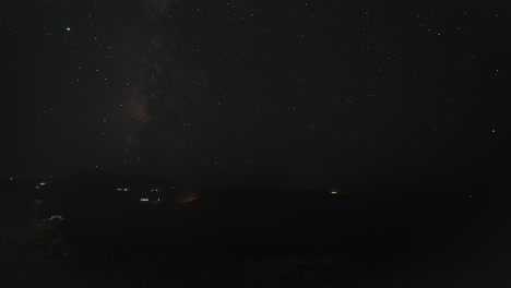 Time-Lapse-of-Moon-going-down-behind-Ocean-Horizon-at-Night-with-Milky-Way