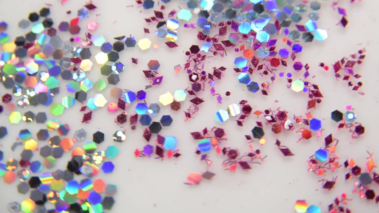 Iridescent glitter particles sprinkled surface
