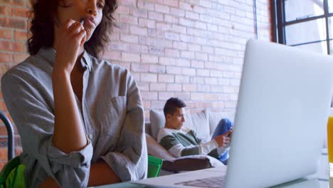 Woman-with-laptop-on-table-at-home-4k