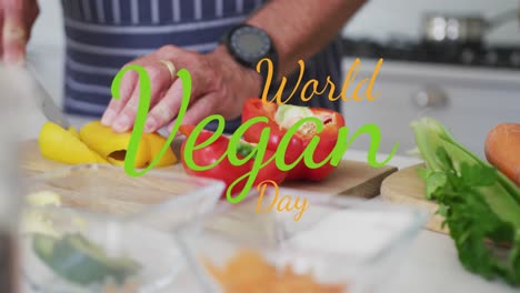 animation of world vegan day text over caucasian man cutting vegetables