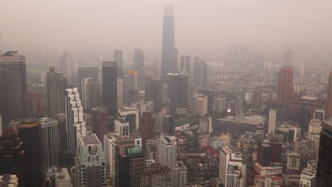 foggy view of cityscape skyline from kl tower in kuala lumpur, malaysia