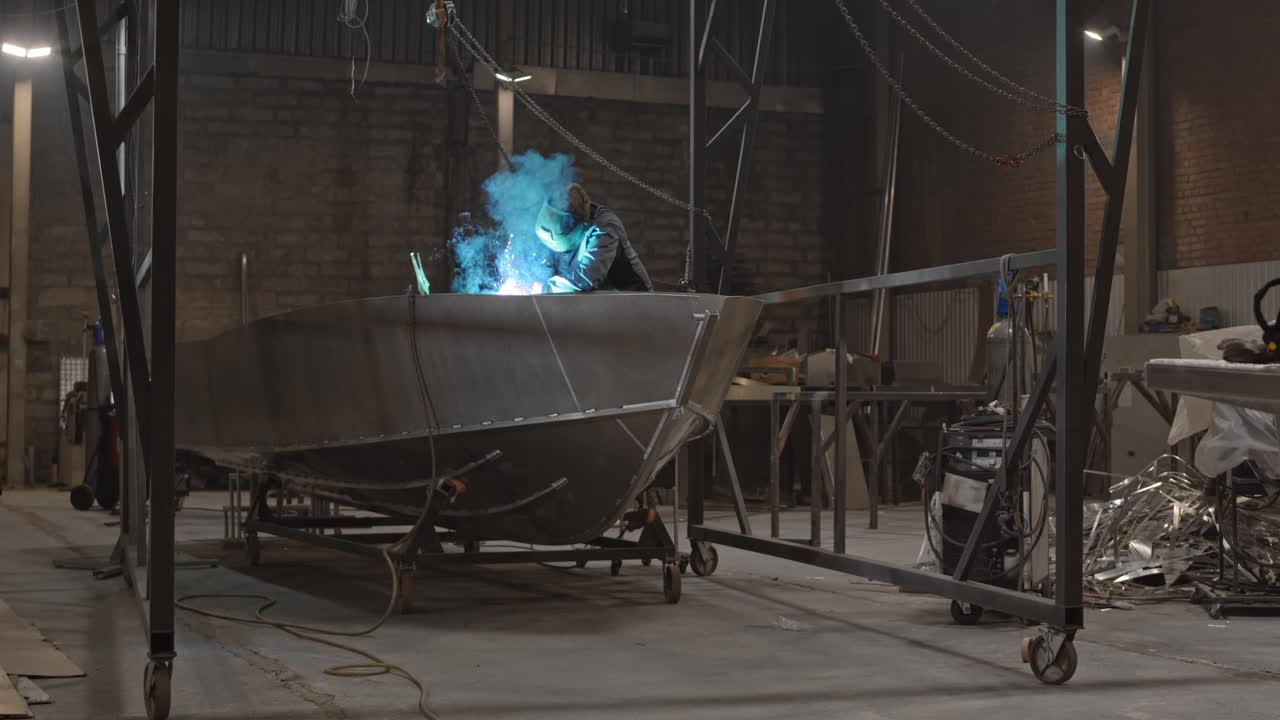 Welding a Boat in a Workshop