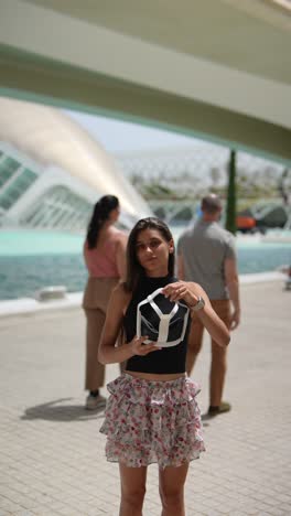 woman experiencing vr technology in a city park