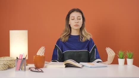 Young-woman-meditating-looking-at-camera.