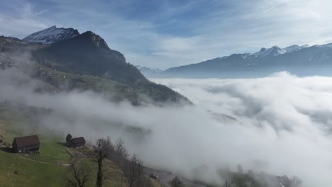 nebel-walensee an den hängen von amden. schweiz luftbild