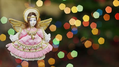 christmas angel doll at bokeh lights. title area