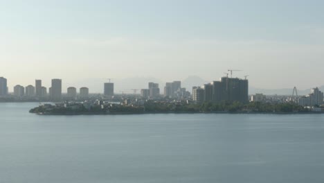 landscape view of hanoi skyline from tay ho lake in tay ho district, vietnam. static shot
