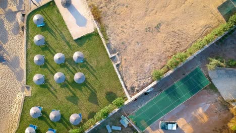 Beach-umbrellas-cast-morning-shadows-at-resort-on-island-of-Zakynthos