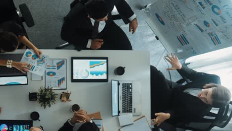 Top-view-of-manager-point-at-financial-graph-on-whiteboard.-Directorate.