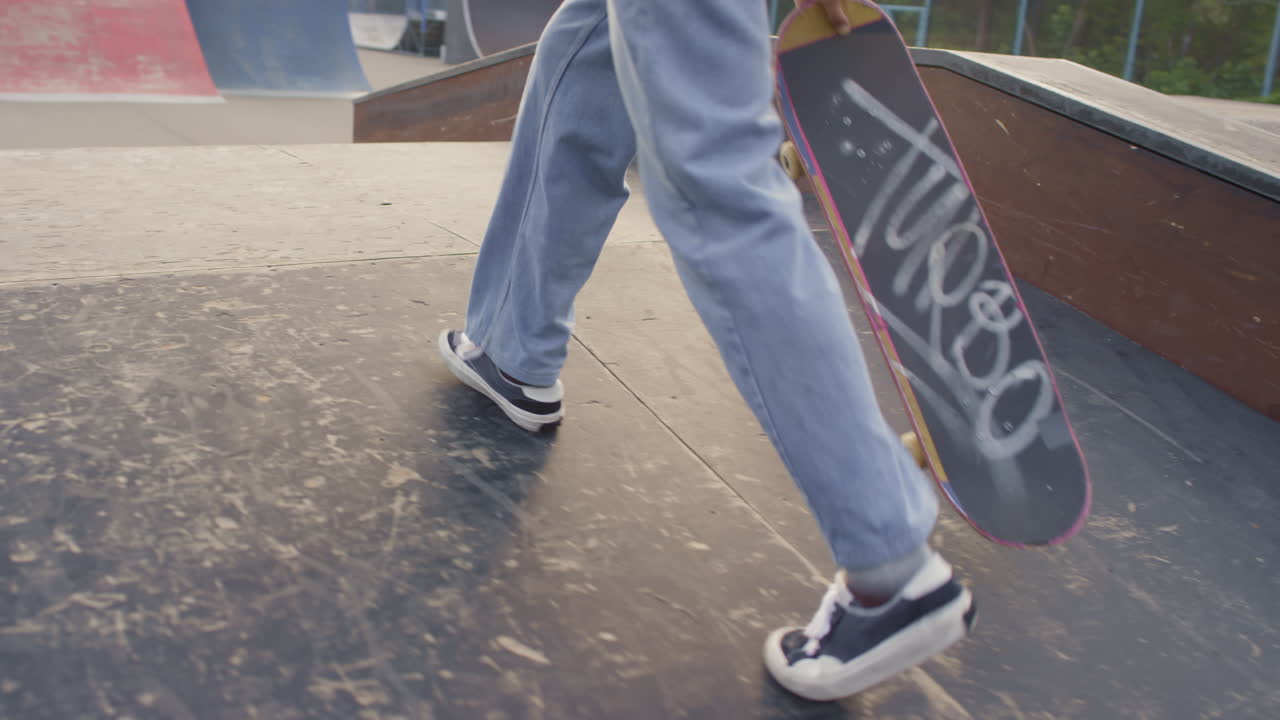Unrecognizable Teenager in Skatepark