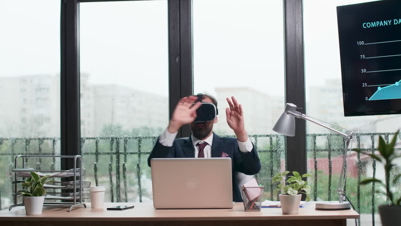 Businessman using VR headset in office with company data on screen