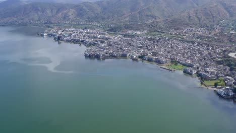 village and lake in shuanglang, yunnan, china.