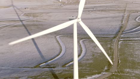 Aerial-shots-of-wind-turbines-on-a-cold-winter-afternoon-in-Calhan,-Colorado