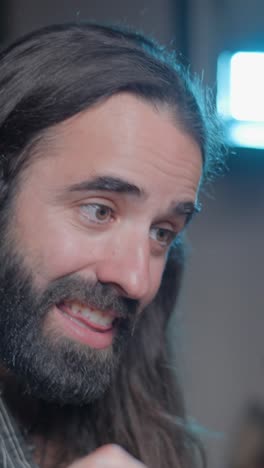 close-up of a bearded man with long hair