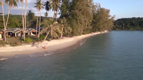 beautiful aerial view flight fly reverse long panorama overview drone footage of
yoga girl palmtree koh kood sunset seacret beach thailand 2022