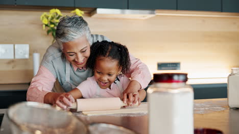 grandmother and granddaughter baking together in the kitchen
