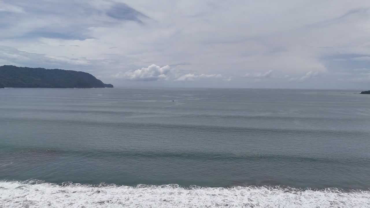 Aerial footage of the beach from a hotel with a pool, Tambor Beach, Puntarenas, Costa Rica