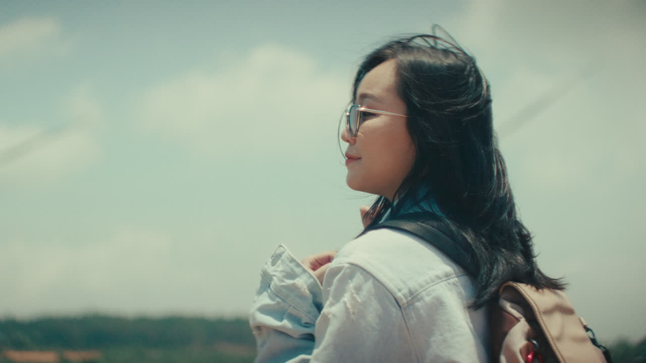 Woman enjoying the view at a wind farm