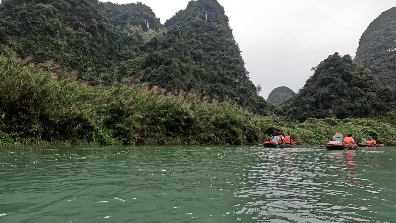 Tourists rowing through a picturesque landscape