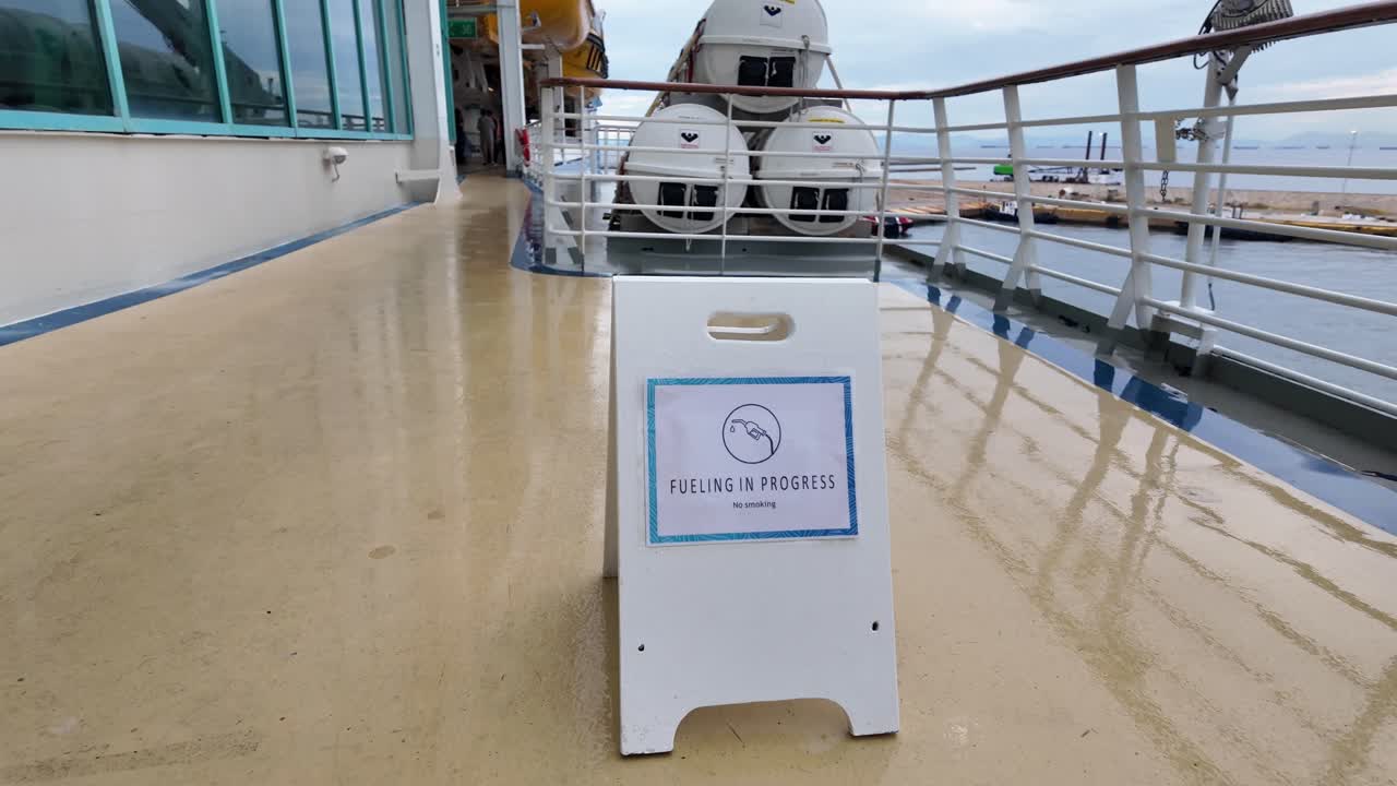 ship refueling barge fueling up a cruise ship in Pireaus, Athens, Greece