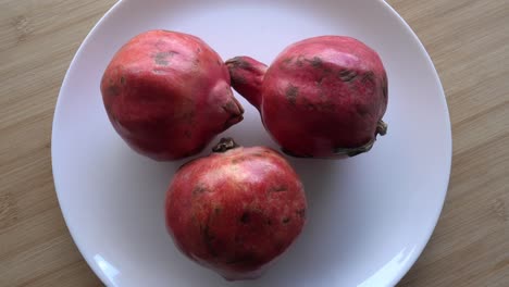 rotating pomegranate fruit, top view, 4k