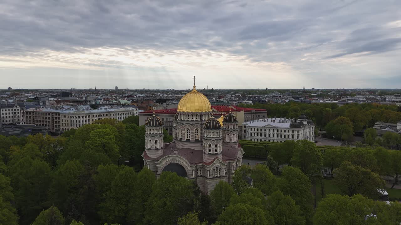 Nativity of Christ Cathedral, Riga, Latvia - A Striking Neo-Byzantine Landmark Known For its Golden Dome and Rich Orthodox Heritage - Aerial Pullback Shot