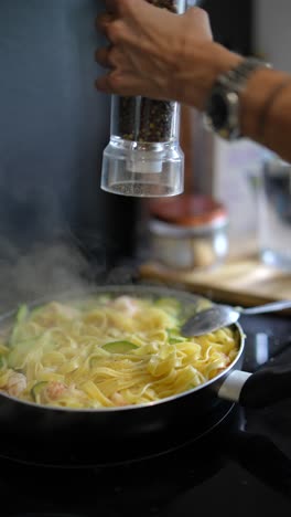 preparing a delicious shrimp and zucchini pasta dish