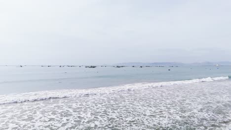 aerial view dolly of the beach and boats in ninh thuận.