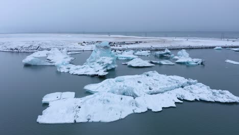 jökulsárlón glacier lagoon in iceland - aerial drone shot