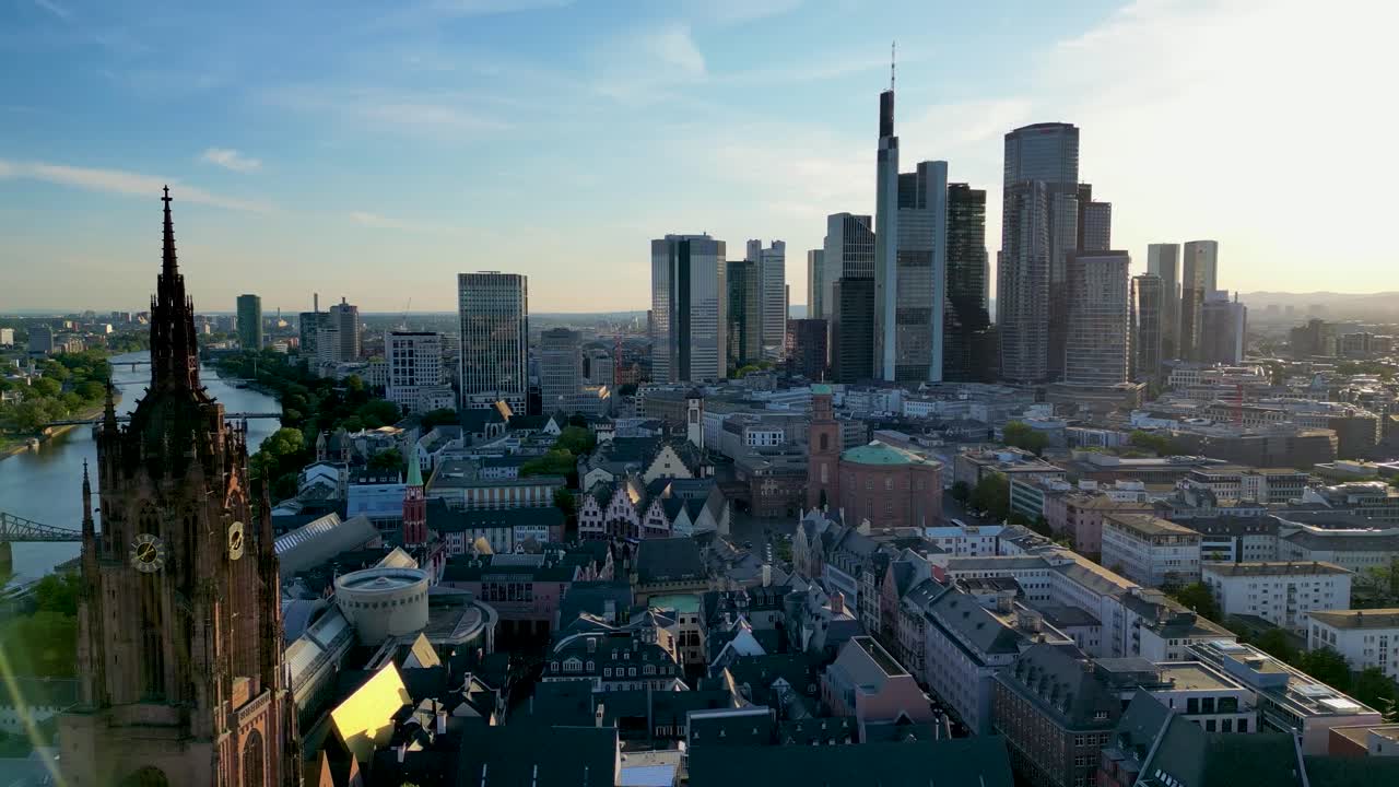 4K Drone Video of the Spire of the Gothic-Style Kaiserdom St. Bartholomäus Cathedral with the Skyline of Downtown Frankfurt, Germany in the Background