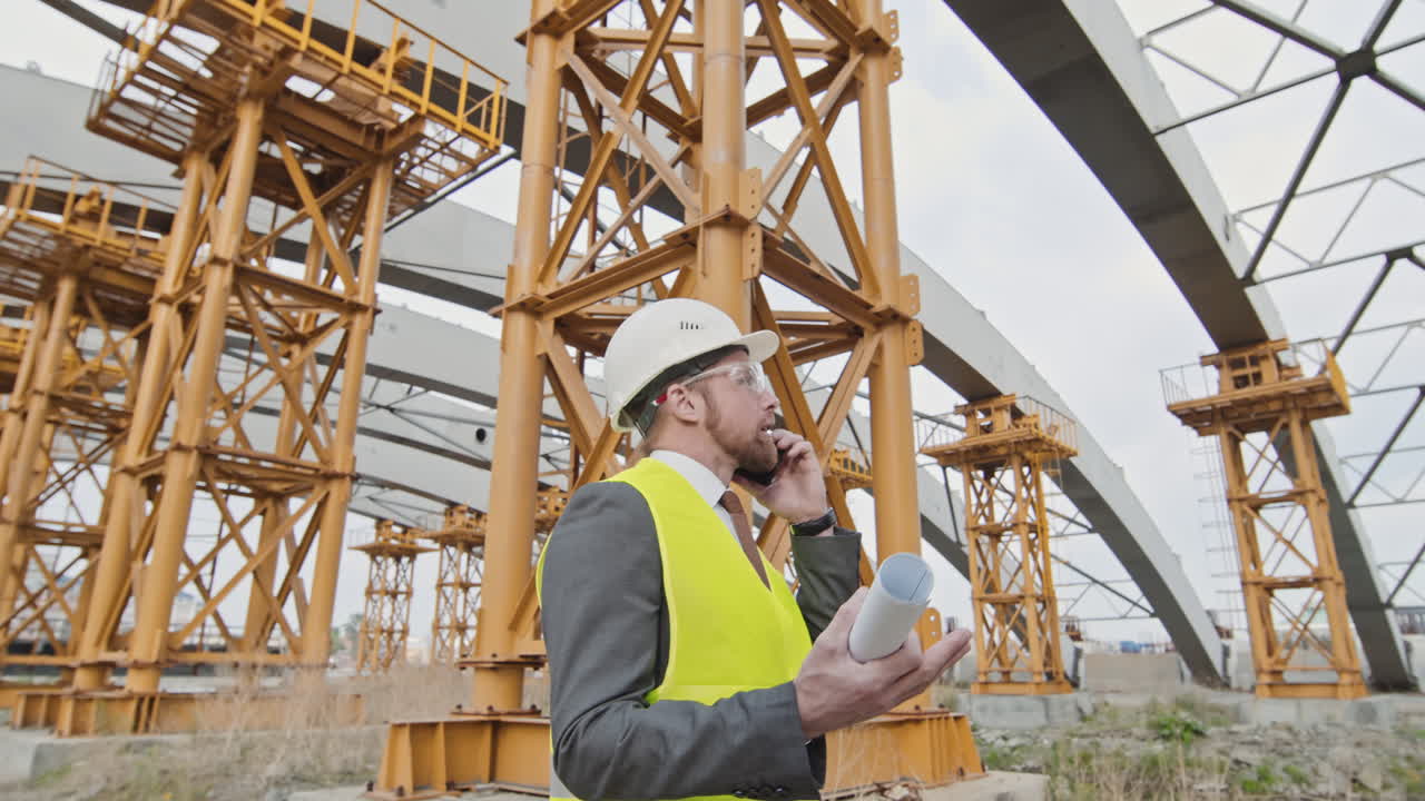 Male Site Supervisor Having Phone Call