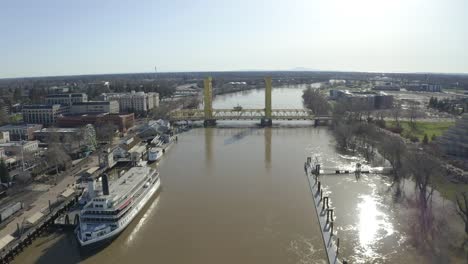 aerial view from the middle of the overflowing sacramento river on a clear sunny day