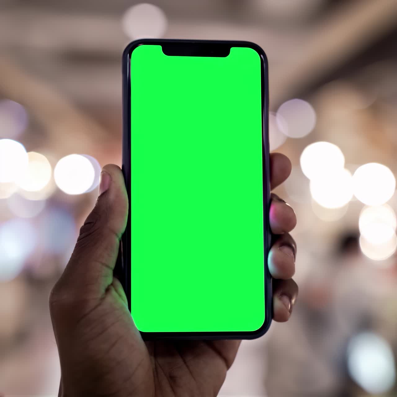 Smartphone screen live mockup in hand animation, transparent 4K video, green screen