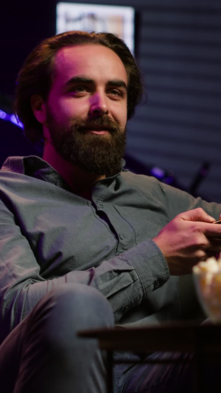 Vertical video Upbeat player engaging in fun videogames, enjoying leisure time