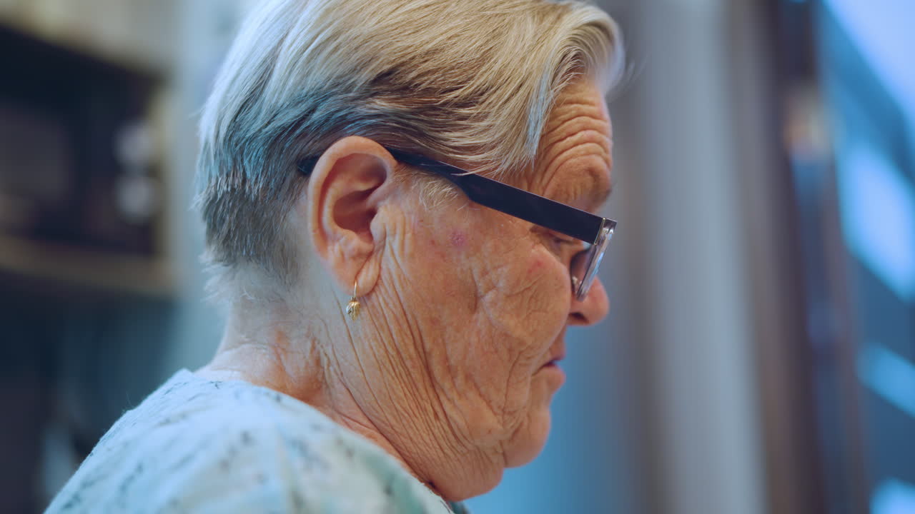 Cool kitchen profile closeup white grandma, elderly white woman near refrigerator with magnets, soft blue ambient light, domestic interior with shelves and appliances, thoughtful expression, everyday