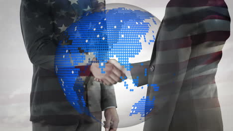 animation of globe and american flag over businessman handshake