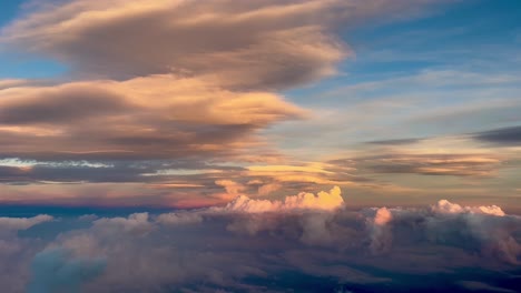 Amazing-view-from-a-jet-cockpit,-pilot-point-of-view-of-a-extraordinary-colorful-sky-and-clouds-during-sunset,-arriving-to-Valencia-airport