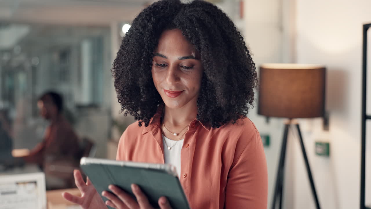 Businesswoman using tablet in modern office