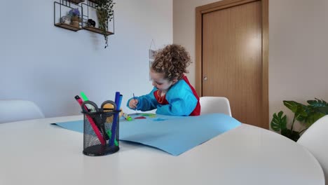 child drawing on table