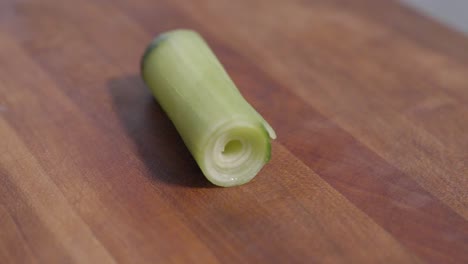 Static shot of rolled cucumber skins carefully arranged as sushi art, showcasing culinary creativity and presentation skills in Japanese cuisine. Ideal for sushi, food styling, and decoration content