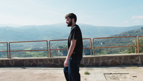 young man walks in the park overlooking the landscape of calabria