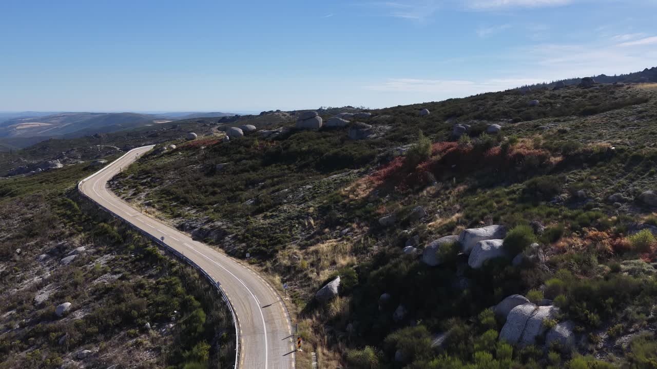 Cyclists riding their bicycles on the road in the mountains