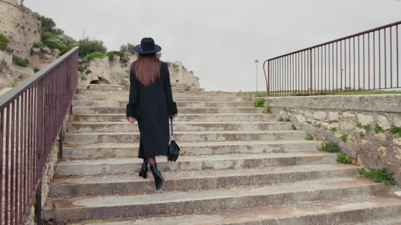 Elegant Woman Going Up The Stairs Of The Town Square