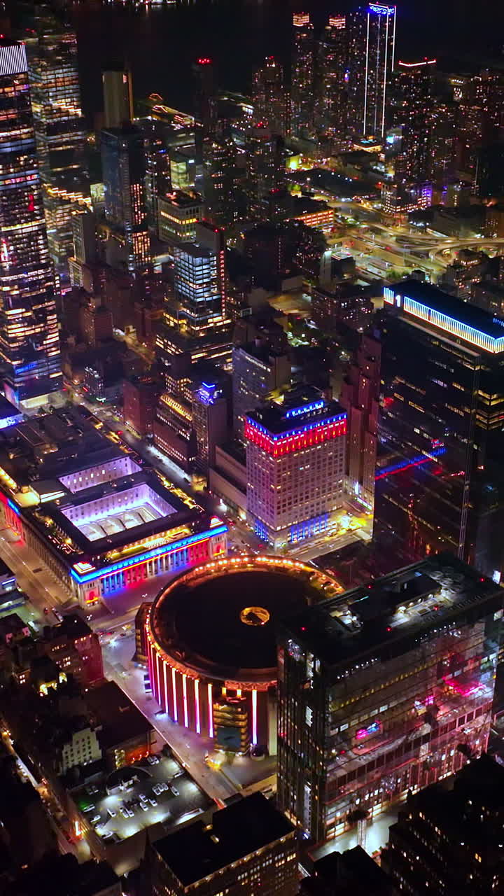 Dazzling sight of stunning New York architecture at night. Top view scenery of Midtown Manhattan from air. Vertical video